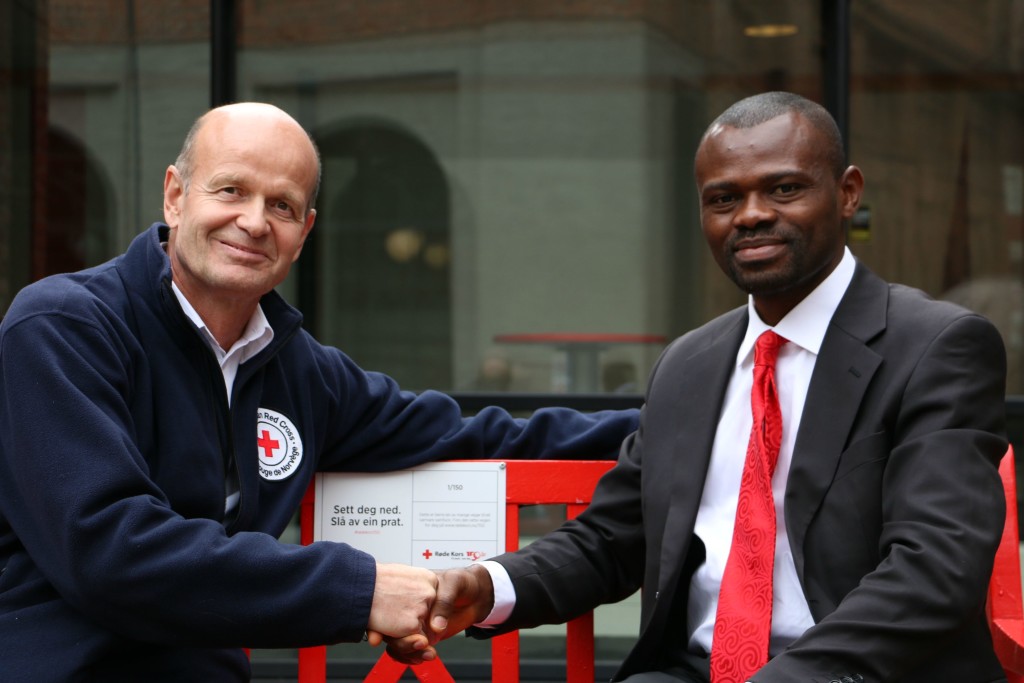 Mr. Martin Anagboso, Director of Public Relations MICPA presenting the award donation to  Mr. Sven Mollekleiv, President of Norwegian Red Cross at Norwegian Red Cross office in Oslo, Norway